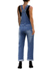 Back view of model in dark blue cuffed hem ripped bib denim overall jumpsuit