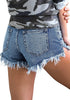 Angled back shot of model wearing dark blue frayed raw hem distressed denim shorts
