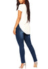 Back full body shot of model in dark blue drawstring-waist washout ripped skinny jeans
