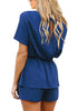 Back view of model wearing blue short sleeves keyhole-back belted romper