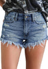 Front view of model wearing dark blue frayed raw hem distressed denim shorts